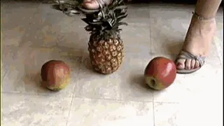 Pineapple and apples crushed under high heels sandals