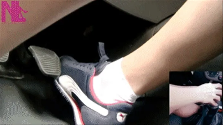 Driving and pedal pumping in blue Nike sneakers and white socks