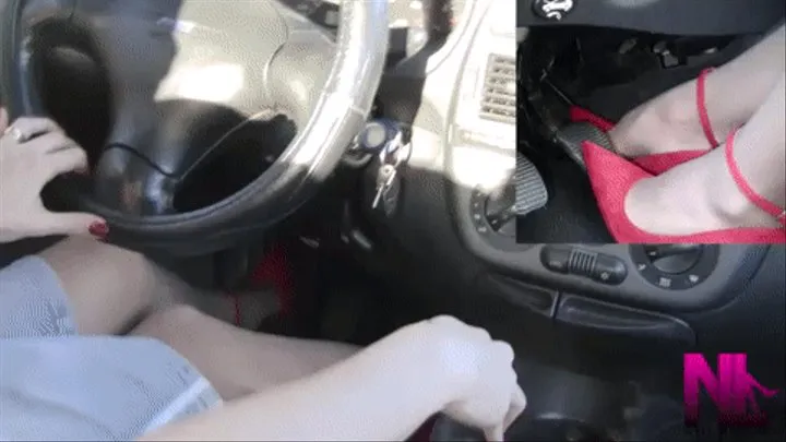 Sexy driving in red buckled pumps and handjob to the gear stick