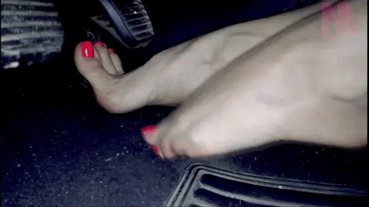 Cute barefoot pedal pumping with vivid pink nailpolish