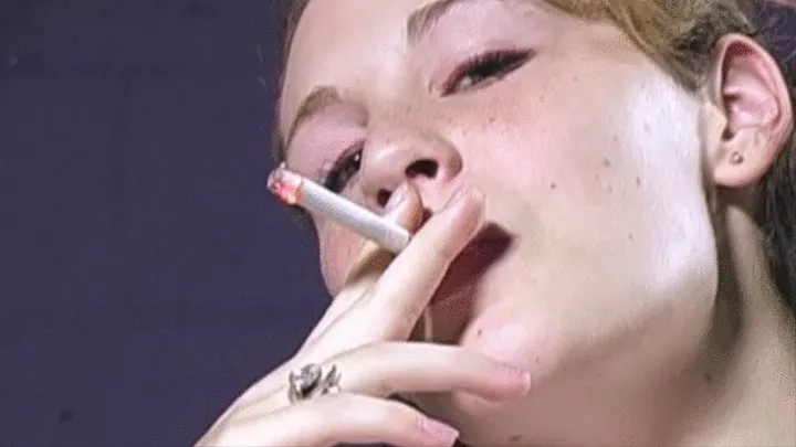 Freckled teen is a sexy smoker