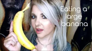 Eating a large banana