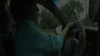 Natalya driving and smoking