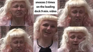 Mandi loading dock sneeze, 3 times and takes off her shoes.