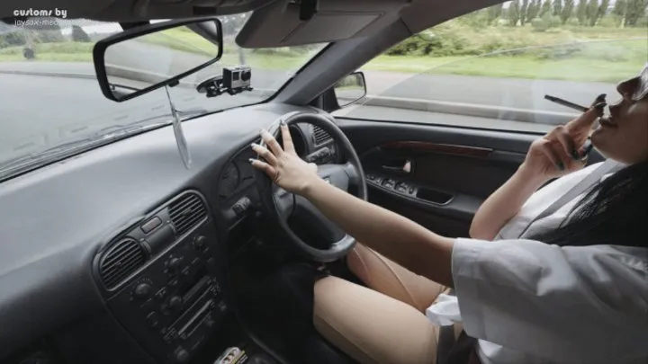 Tiana drives in Jodhpurs and Blouse and smokes Side View