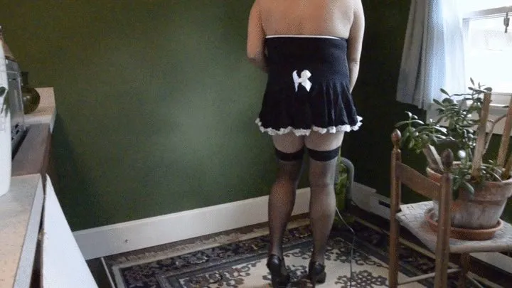 Jill dressed as a French Maid, doing some vacuuming