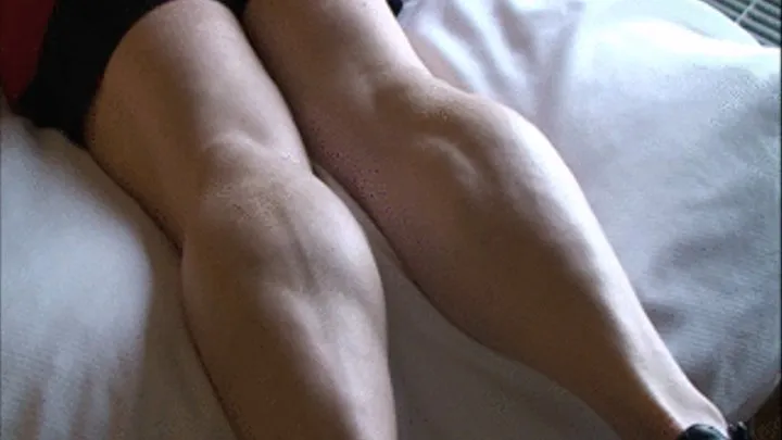 Christal Bently, lying on her belly in the motel, flexing her calves