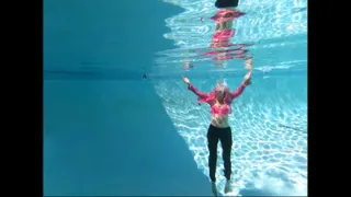 Liz swims underwater in her pink button up dress shirt and buttons it up slowly and sexy underwater!