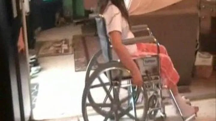 Nokie in a wheel chair over a hurt ankle