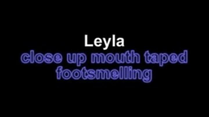 Leyla close up mouthtaped footsmelling