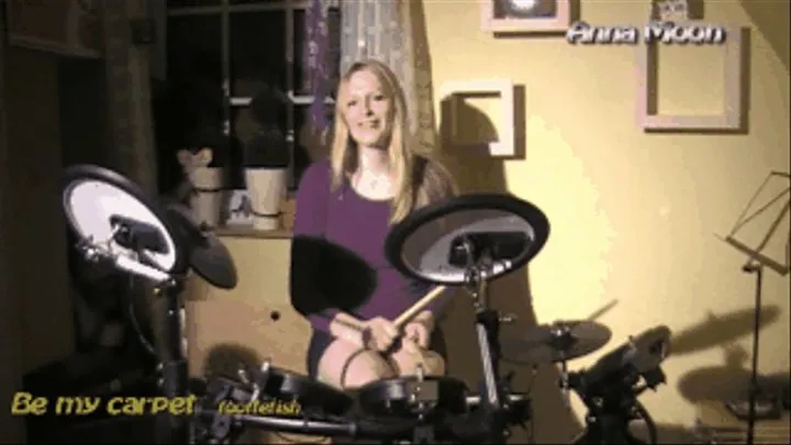 Anna Moon playing in heels and barefeet drums