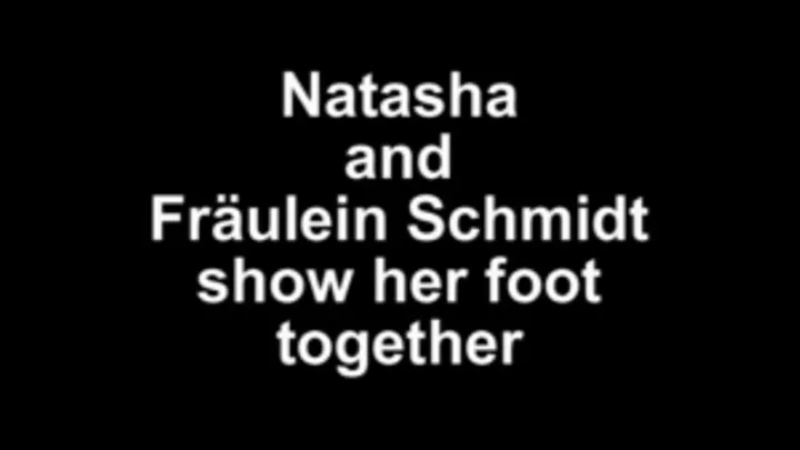 Natasha and Fräulein Schmidt show her foot togther