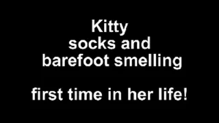 Kitty socks and barefoot smelling ...first time in her life!