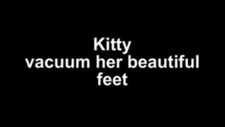 Kitty vacuum her feet with ground nozzle!