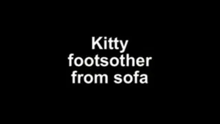 Kitty footsmother from sofa