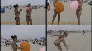 Two girls pop at the beach.