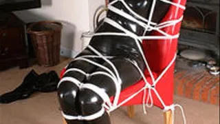 Jaimee Lang chairtied in PVC Catsuit