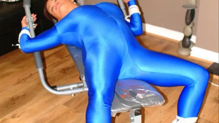 Teresa May Tied to Workout bench in Blue Lycra,Spandex Catsuit