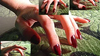 Dark red fingernails tapping/drumming on surface