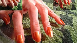 Orange fingernails on surface