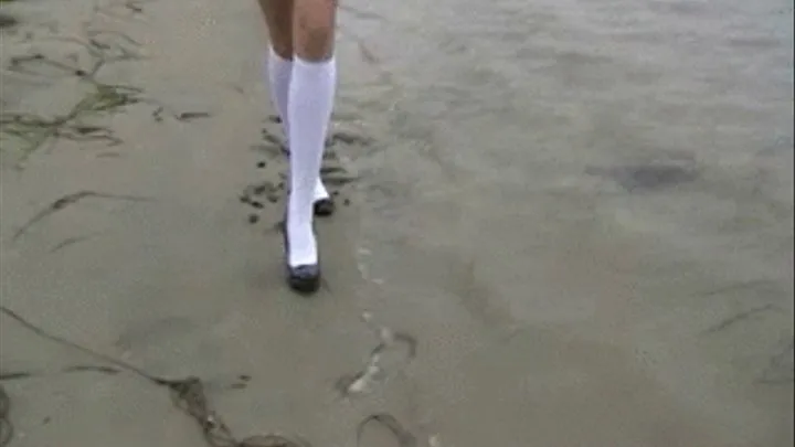 Black high heels & white socks at the beach