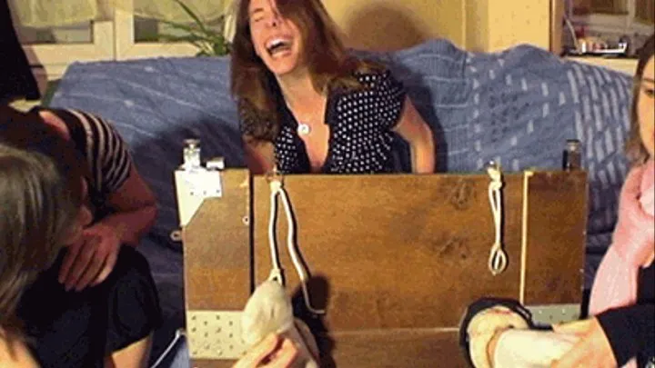 Deborah's socked feet tickled in the stocks