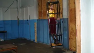 Handcuffed caged blond tries to escape