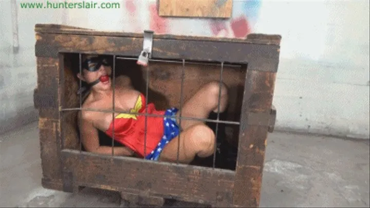 Cage crime fighter strung up by her cuffed wrists