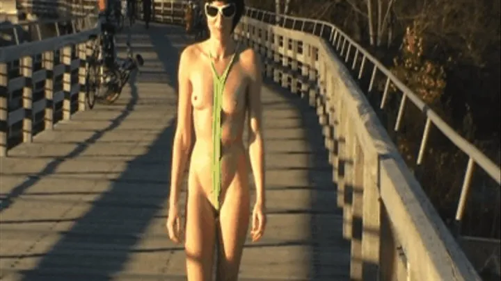 Jessica is stripping down a green sling bikini on a public bridge