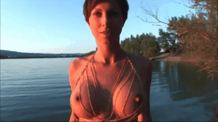 Janka only with a golden body chain at a public beach