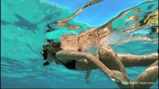 Katya is snorkeling and topless on the boat in Cuba