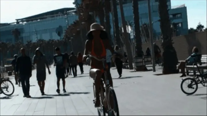 Manu's sexy bicycle ride on the beach promenade