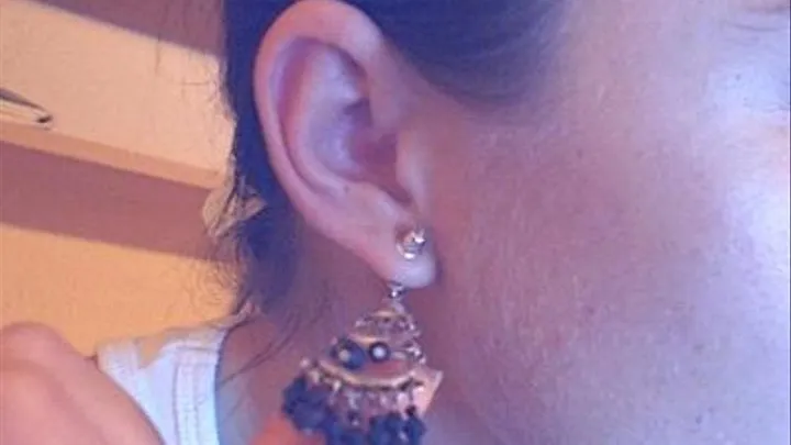 Put on earrings in backwards(from back to front)