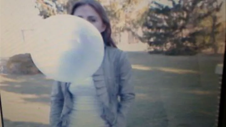 Outside blowing large bubbles