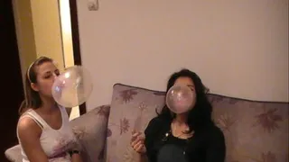 2 Sexy brunettes blowing bubbles