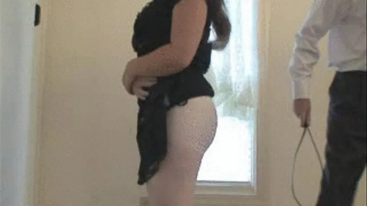 spanked with belt over pantyhose while standing (side view)