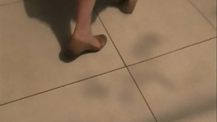 2 pairs of flats barefoot under table @ food court