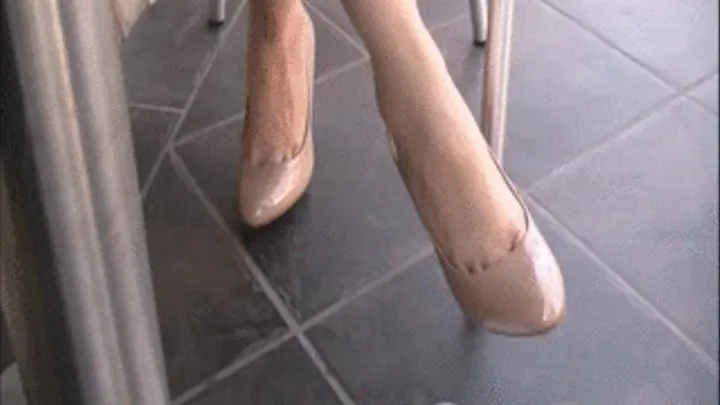 New nude patent high heels barefoot under the table