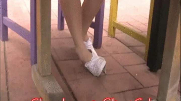 Barefoot shoeplay in keds under table