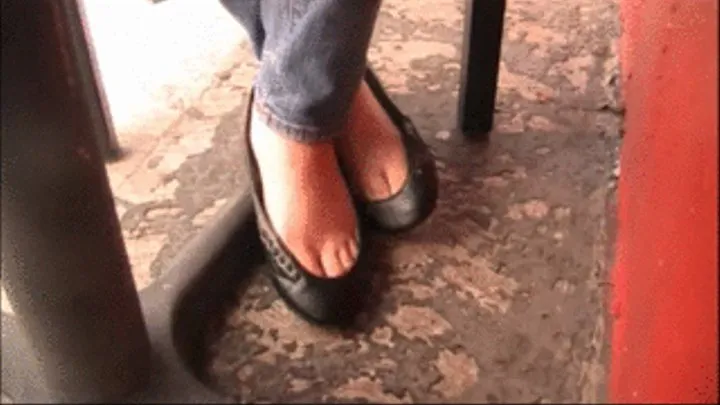 Toe cleavage ALDO black leather flats barefoot under chair 1