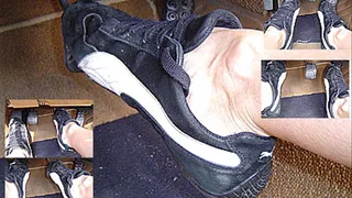 Pedal pumping in black puma sneakers