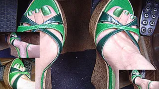 Pedal pumping in green cork wedges