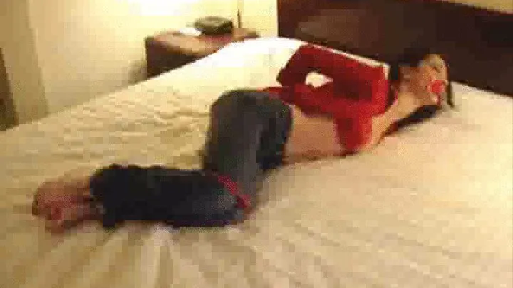 Mina Meow Bound on the Bed in Red