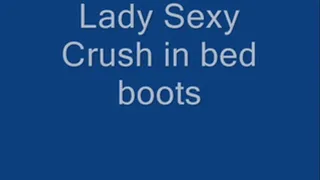 Lady sexy crushing in bed boots