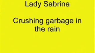 Lady Sabrina crushing Garbage in the rain