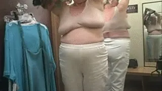 Sexy Mature blond is trying on tops in the dressing room where You can spy on her!