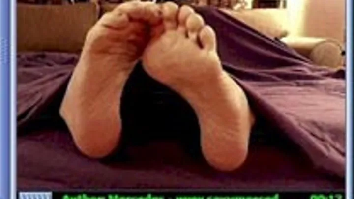 Soles Of Feet Sticking Out From Under The Covers