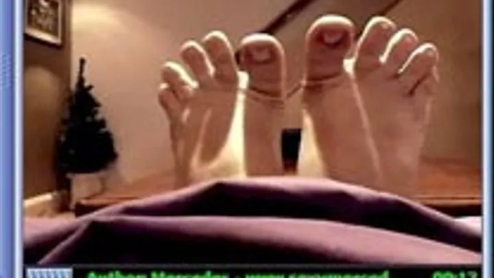 Puppet Feet Sticking Out From Under The Covers - Top Part Of Feet View