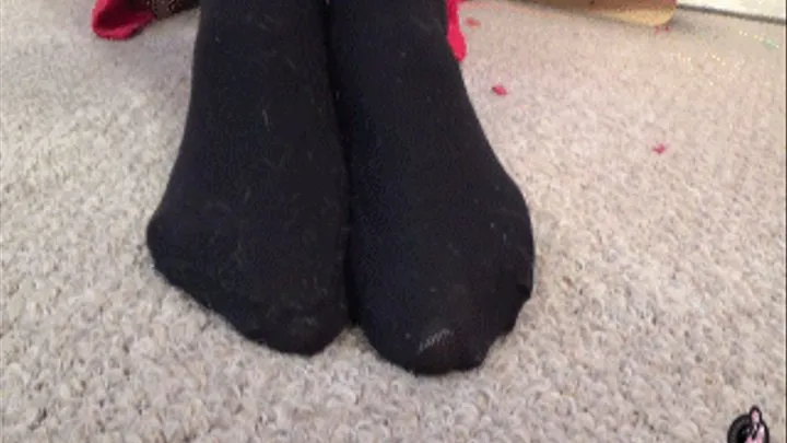 Feet in black socks