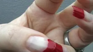 Nail flicking with red nails